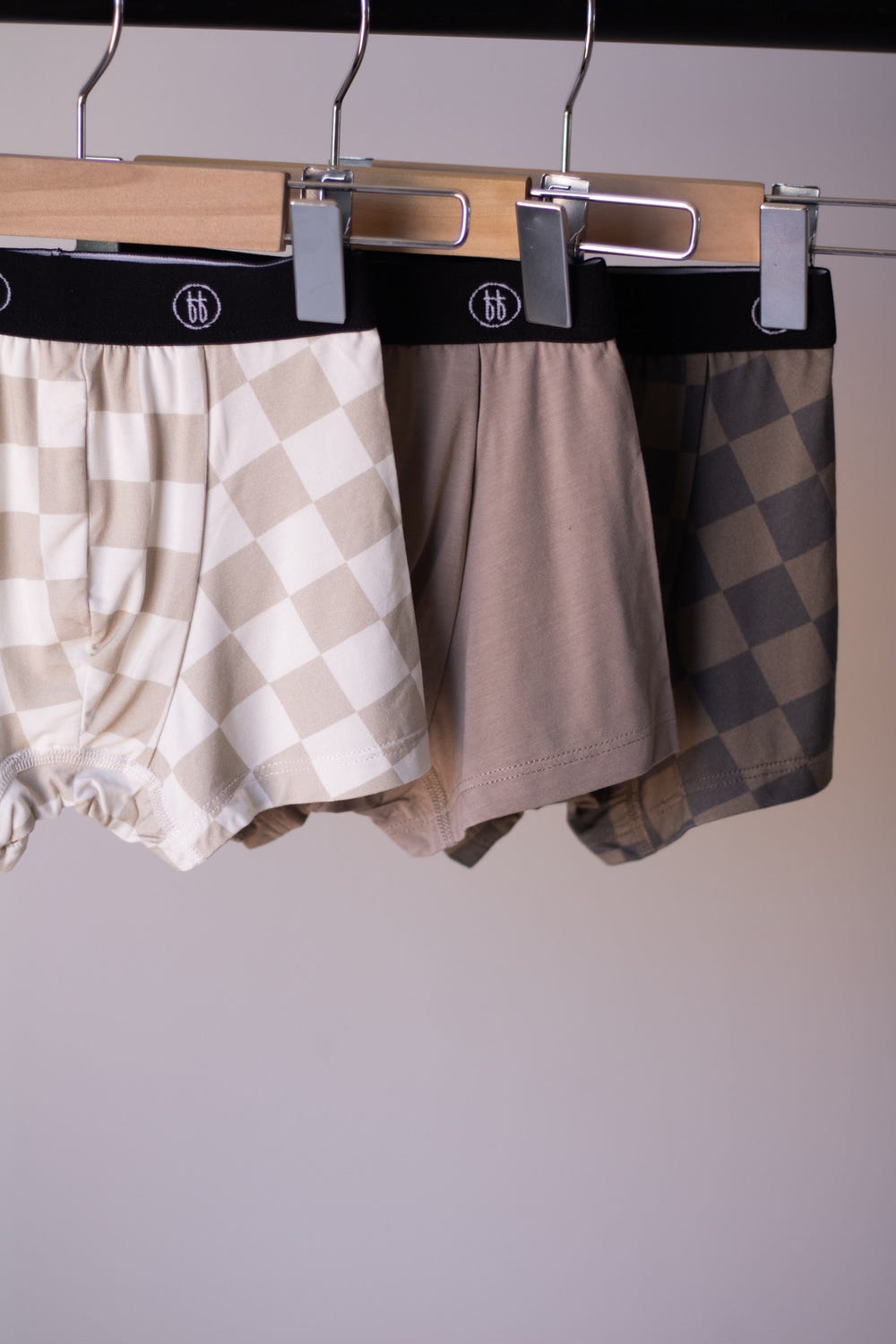 Bamboo boxers 3 pack in checkerboard and faded brown designs for babies, soft and breathable underwear.