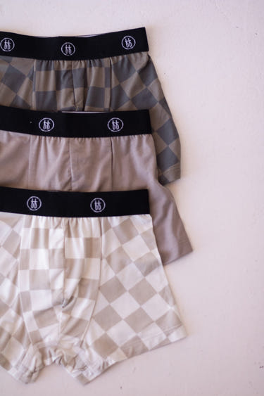 Bamboo boxers 3 pack in checkerboard and faded brown designs for babies, soft and breathable underwear.