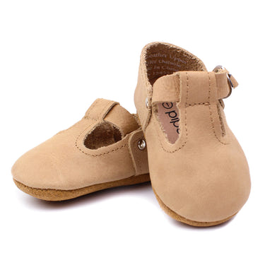 Tan T-Strap Mary Jane soft sole baby shoes - stylish and comfortable for little feet.