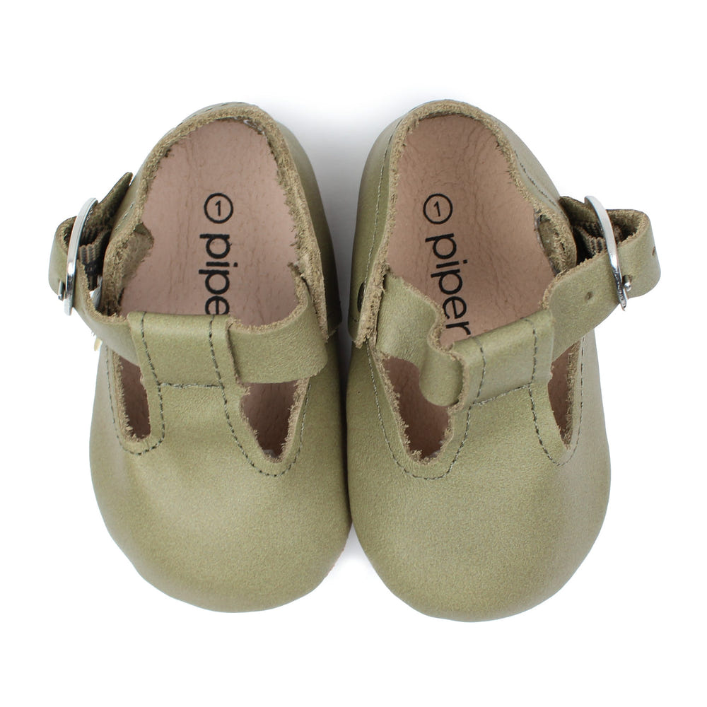 Olive T-Strap Mary Jane soft sole baby shoes in a stylish design, perfect for little ones' comfort and support.
