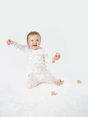 Organic cotton leggings in yellow hearts design for babies, soft and comfortable for everyday wear.