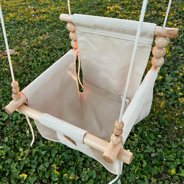 Premium outdoor high back swing in wheat color, perfect for comfortable outdoor relaxation.