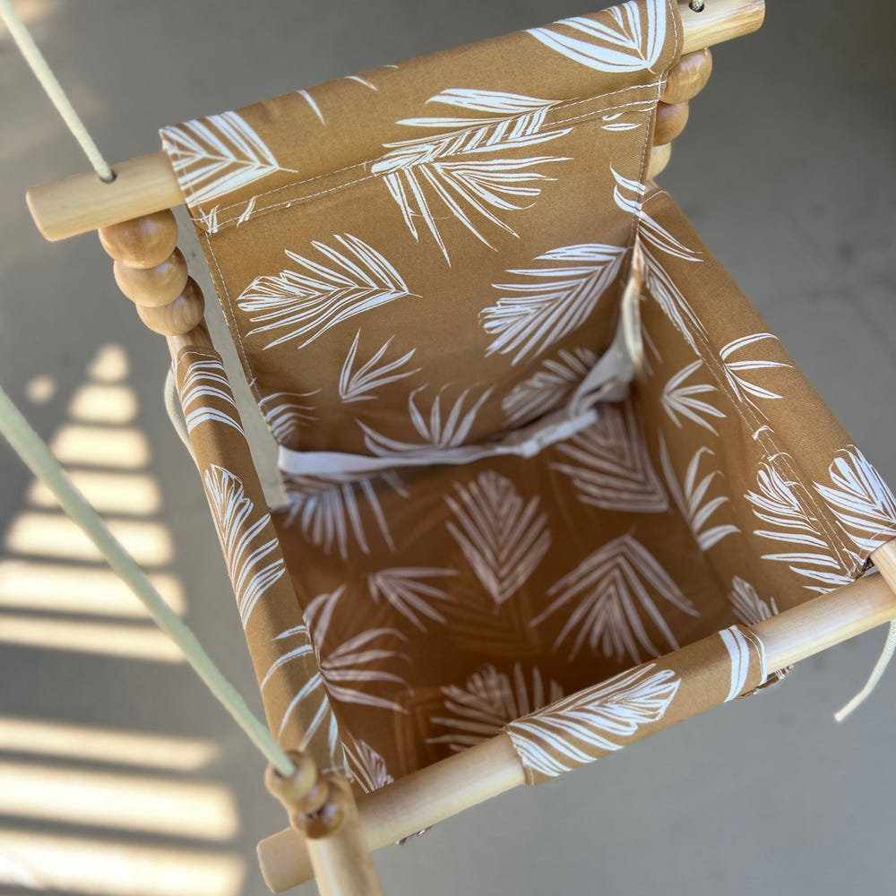 Nutmeg Leaf outdoor baby swing, perfect for safe and fun outdoor playtime.