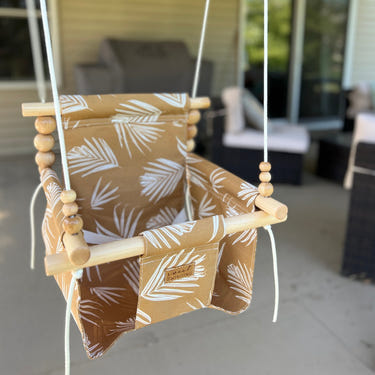 Nutmeg Leaf outdoor baby swing, perfect for safe and fun outdoor playtime.