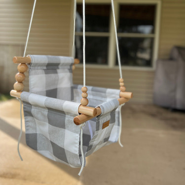 Outdoor high back baby and toddler swing in gray buffalo check, perfect for pre-order.
