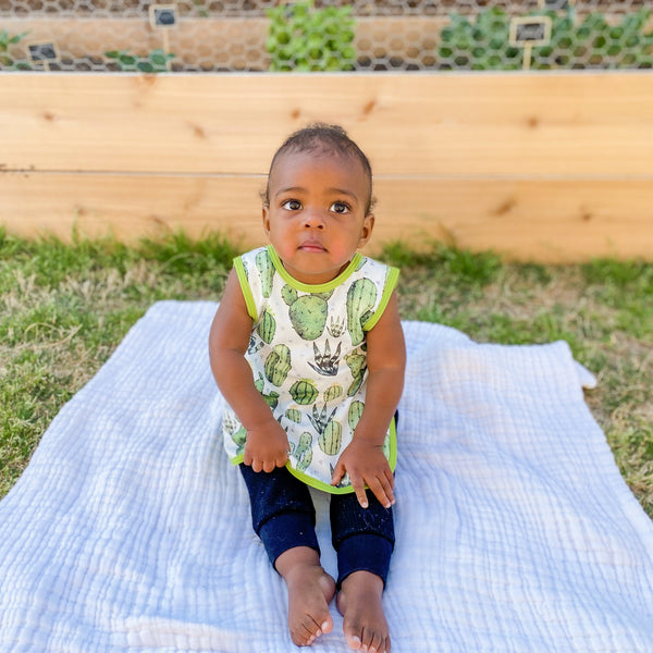 Desert Cactus Bapron for babies, stylish and functional, shown at an angle for a clear view of its design.
