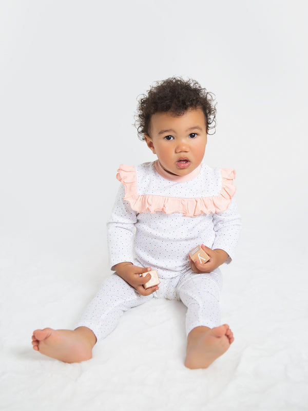Organic cotton polka dot leggings for babies, soft and comfortable for everyday wear.