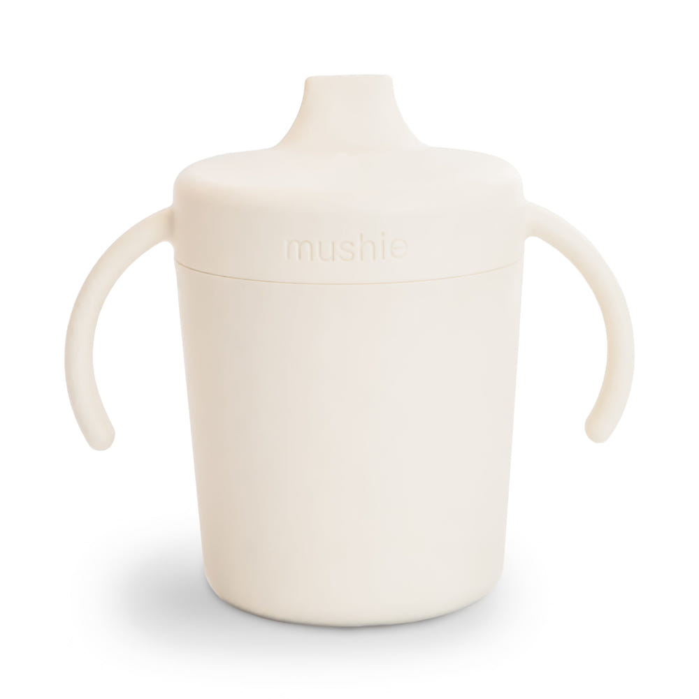 Trainer sippy cup for toddlers, featuring easy-grip handles and spill-proof design, perfect for transitioning to independent drinking.