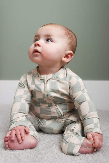Ivy Wavy Checkers Romper for babies, featuring a stylish checkered design in soft fabric. Perfect for playtime!