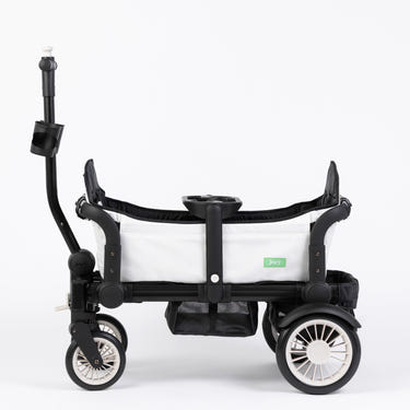 The Wagon Weekender White stroller wagon for babies, featuring a sleek design and spacious seating.