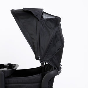 Oversized UV 50+ retractable canopy for baby strollers in Field Trip Black, shown from angle 3.