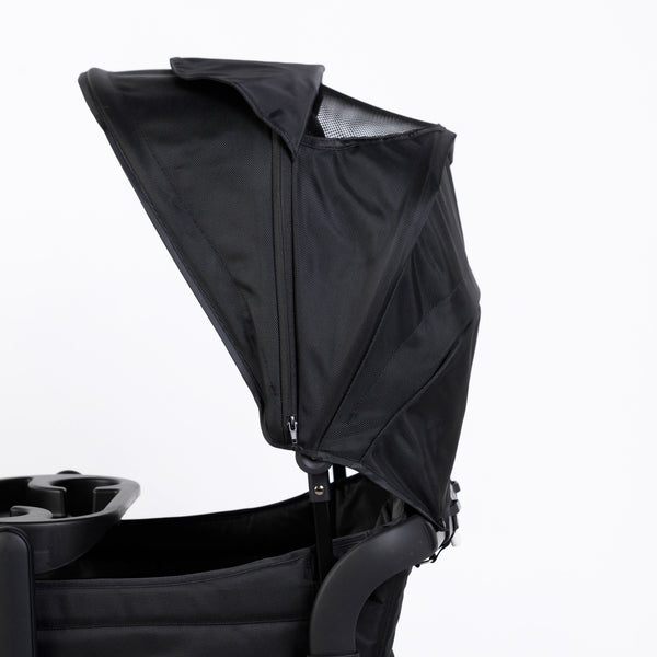 Oversized UV 50+ retractable canopy for baby strollers in Field Trip Black, shown from angle 3.