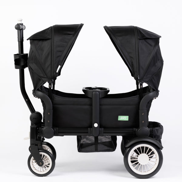 Oversized UV 50+ retractable stroller canopy in Field Trip Black, providing sun protection for babies.