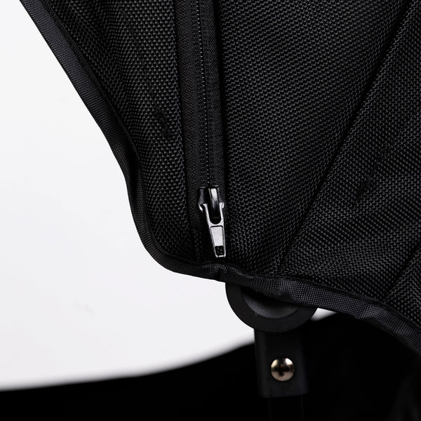 Oversized UV 50+ Retractable Canopy in Field Trip Black for baby strollers, angle view showcasing design and coverage.