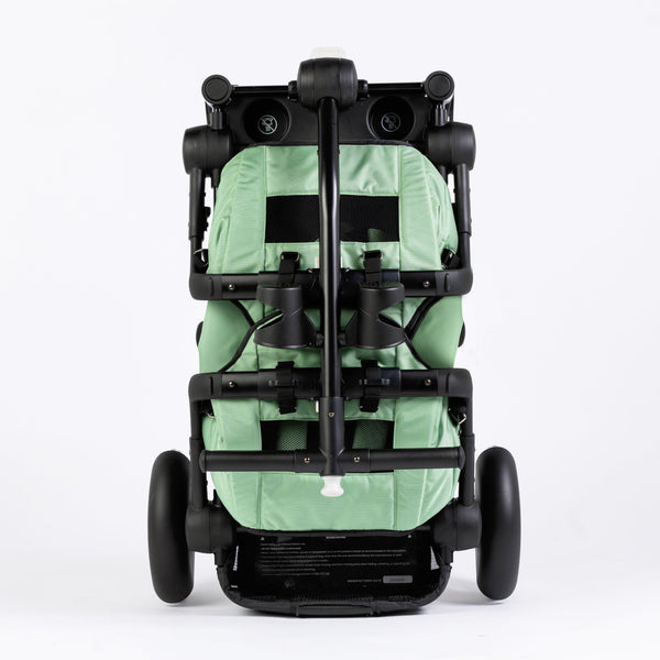 Stroller wagon "The Wagon - Spring Fern" at angle 6, showcasing its stylish design and spacious seating for babies.