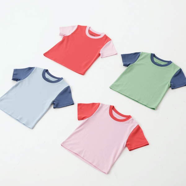 Light blue kids contrast tee with navy blue accents, displayed at angle 3. Perfect for stylish little ones!