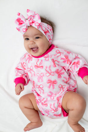 Pink Bows Bubble Romper for babies, featuring a cute design and comfortable fit, perfect for playtime and outings.