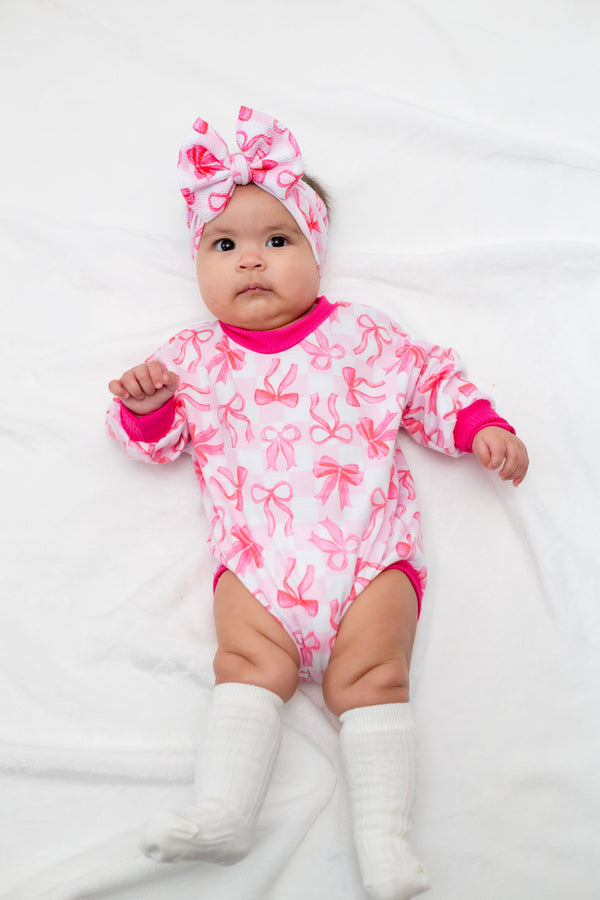 Pink Bows Bubble Romper for babies, stylish and comfortable, perfect for playtime and special occasions.