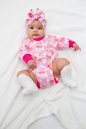 Pink Bows Bubble Romper for babies, featuring a cute design and comfortable fit, shown from angle 3.