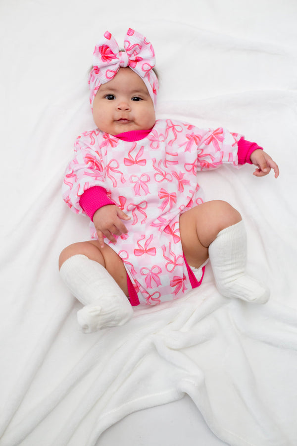 Pink Bows Bubble Romper for babies, featuring a cute design and comfortable fit, shown from angle 3.
