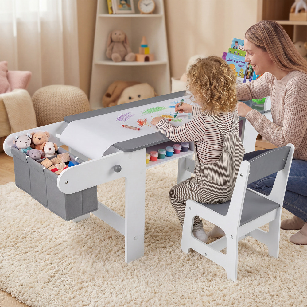 Kids art table and chair set in gray with paper roll and fabric bins for drawing, reading, and playing.