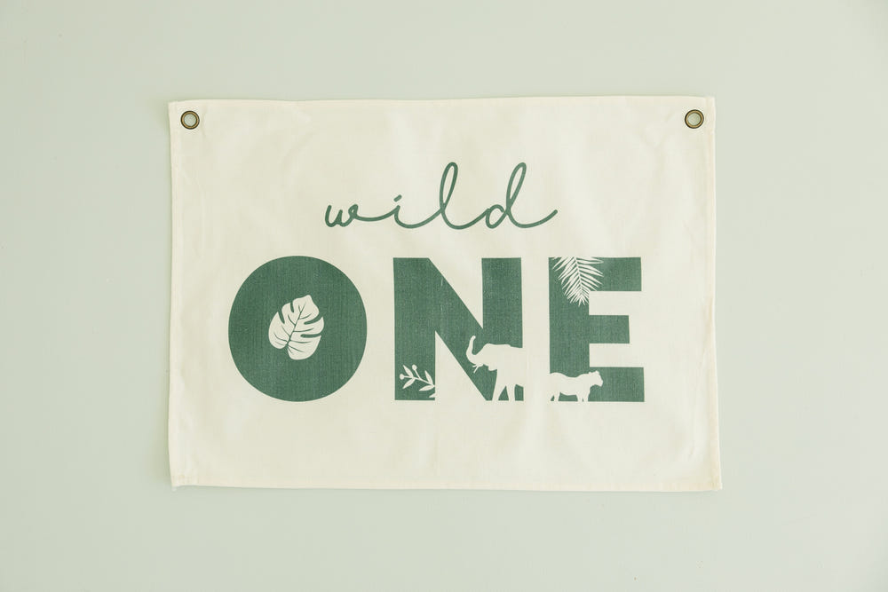 Wild One First Birthday Canvas Banner - Jungle Theme for kids' wall art and prints, perfect for celebrating a first birthday.