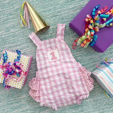 Pastel pink first birthday bubble for girls, perfect for celebrating a special milestone in style.