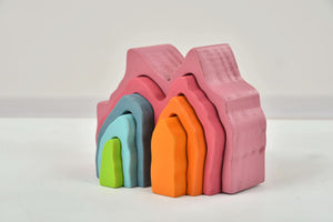 Wooden Mountain Rainbow Stacker Toy Puzzle Blocks for indoor play, promoting creativity and fine motor skills in babies.