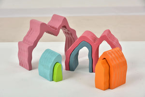 Wooden Mountain Rainbow Stacker Toy Puzzle Blocks for indoor play, showcasing vibrant colors and unique design from angle 4.