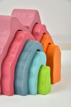 Wooden Mountain Rainbow Stacker Toy Puzzle Blocks in vibrant colors, perfect for indoor play and early childhood development.