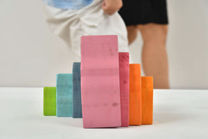 Colorful wooden mountain rainbow stacker toy puzzle blocks for indoor play.