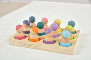 Colorful wooden rainbow peg dolls set, 12 pieces, perfect for indoor play and imaginative fun.