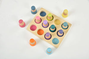 Colorful wooden rainbow peg dolls set, 12 pieces, perfect for indoor play and imaginative activities.