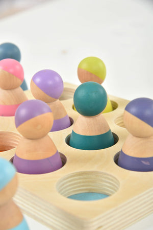 Wooden rainbow peg dolls set of 12, colorful figures for indoor play and creative learning.