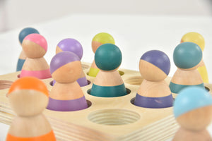 Colorful wooden rainbow peg dolls set of 12, perfect for indoor play and imaginative activities.