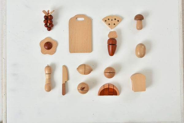 Colorful wooden play food sets for kids' kitchen, perfect for imaginative indoor play.