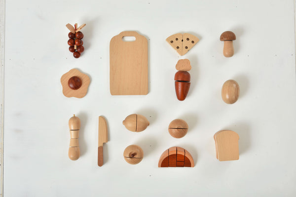 Wooden play food set for kids' kitchen, featuring colorful pieces for imaginative indoor play. Angle 17 view.