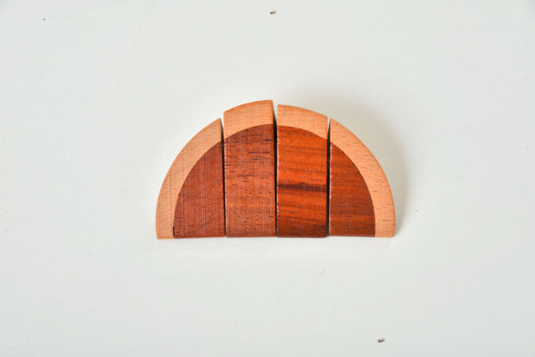 Wooden play food set for kids' kitchen, showcasing colorful pieces at an angle for indoor playtime fun.