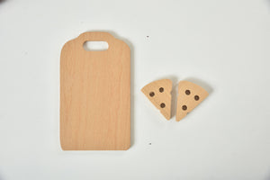 Wooden play food set for kids' kitchen, featuring colorful pieces for imaginative indoor play.