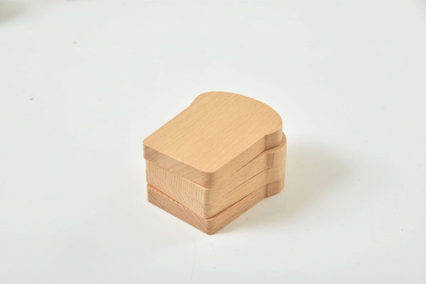 Colorful wooden play food set for kids' kitchen, perfect for imaginative indoor play.