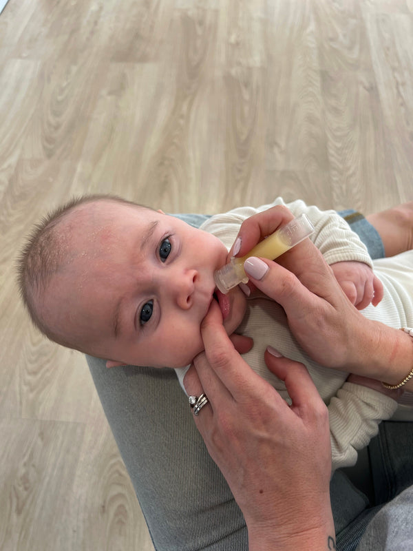 Haakaa 4ml Silicone Colostrum Collectors, 2-pack, pre-sterilized for breastfeeding convenience.