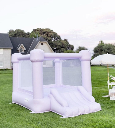 Mini Lila Pastel Purple Bounce House for outdoor playsets, perfect for kids' fun and active playtime.
