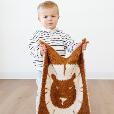 Double-layer Bamboni® mini blankets for babies, perfect for swaddling and keeping little ones cozy.