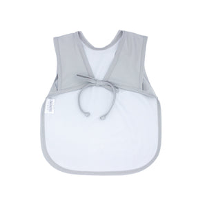 Solid light gray minimalist bapron for babies, angled view showcasing its sleek design and functionality.