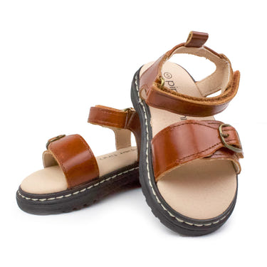 Cognac lug sole sandal for babies, featuring a stylish design and comfortable fit for little feet.