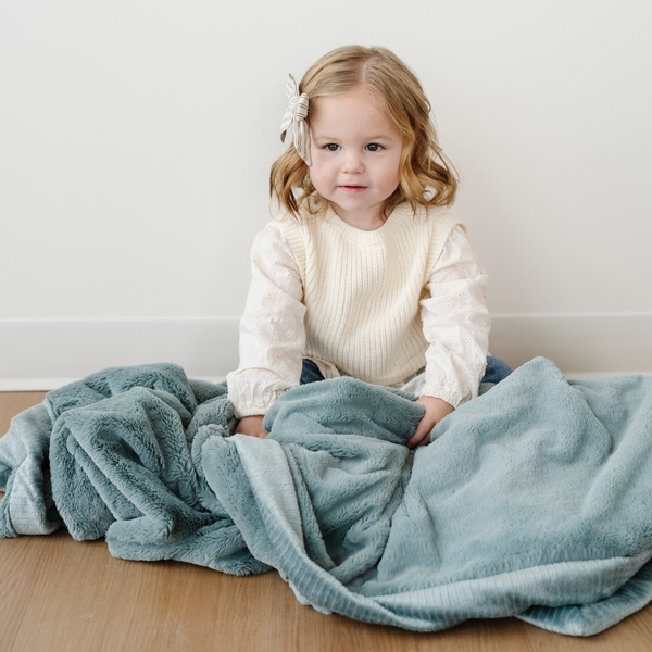 Lush toddler blankets in soft fabric, perfect for cozying up and swaddling little ones. Angle 19 view.