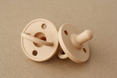 Silicone camel pacifier for babies, soft and safe for soothing comfort.