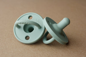 Sage silicone pacifier for babies, soft and safe for soothing comfort.
