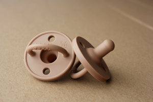 Silicone pacifier in Truffle color, perfect for soothing babies with comfort and style.