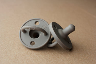 Onyx silicone pacifier for babies, soft, safe, and stylish design for comfort and soothing.